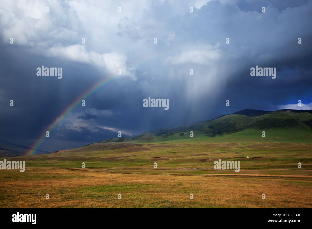 Rainbow after storm in the mountains of Almaty region national park Assy Kazakhstan Stock Photo
