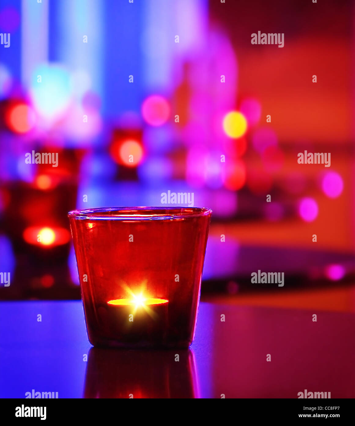 Romantic interior of a luxury restaurant with warm cozy candlelight Stock Photo