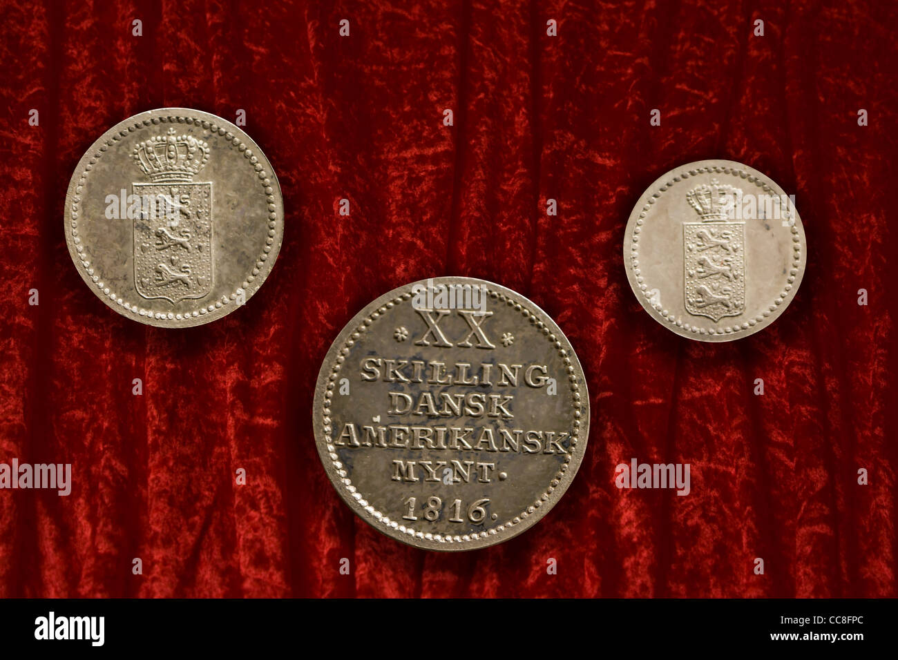 Three old coins from the Danish Westindies Stock Photo