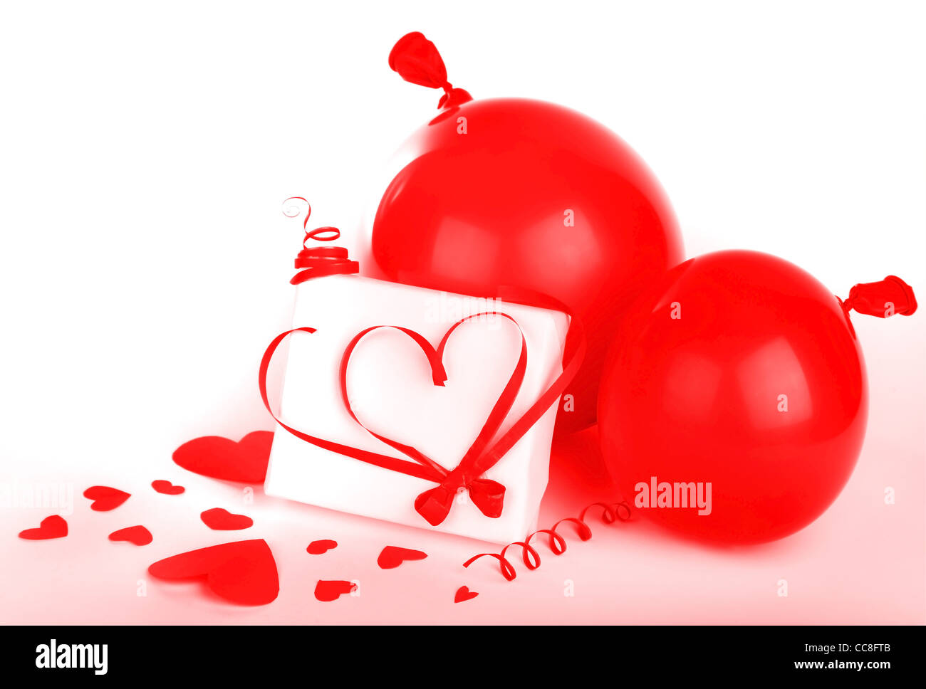 Gift box with red hearts & ribbon isolated on white background ...