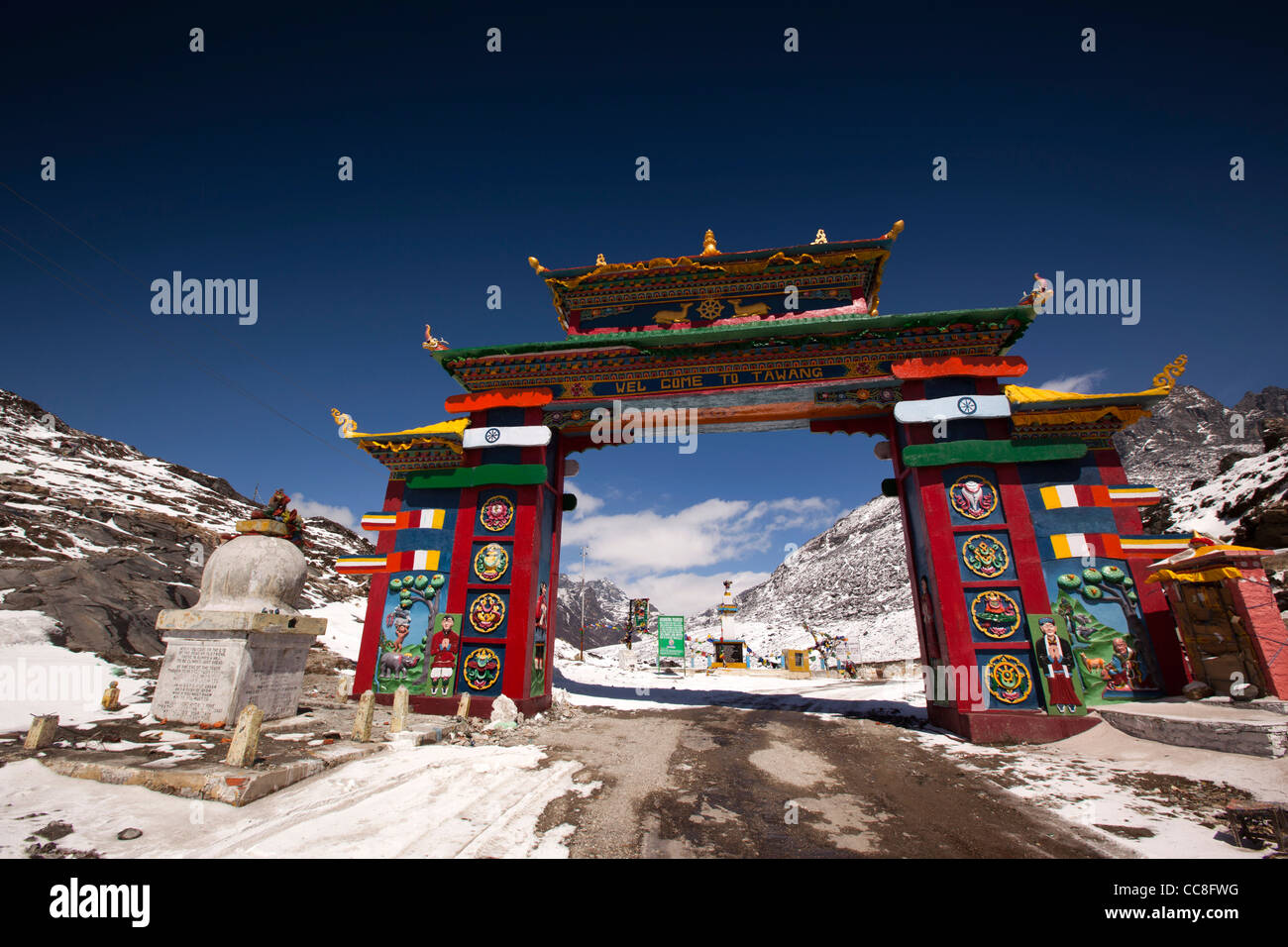 India, Arunachal Pradesh, Sela Pass, high altitude road passing under colourful gateway to Tawang Stock Photo