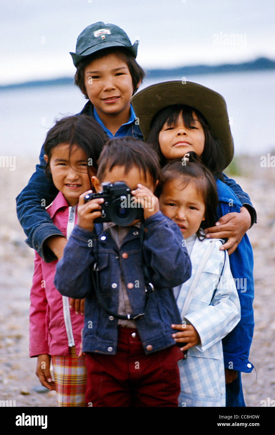 First Nation Aboriginal Children in Fort Severn,Northern Ontario;Ontario;Canada; standing with camera portrait Stock Photo