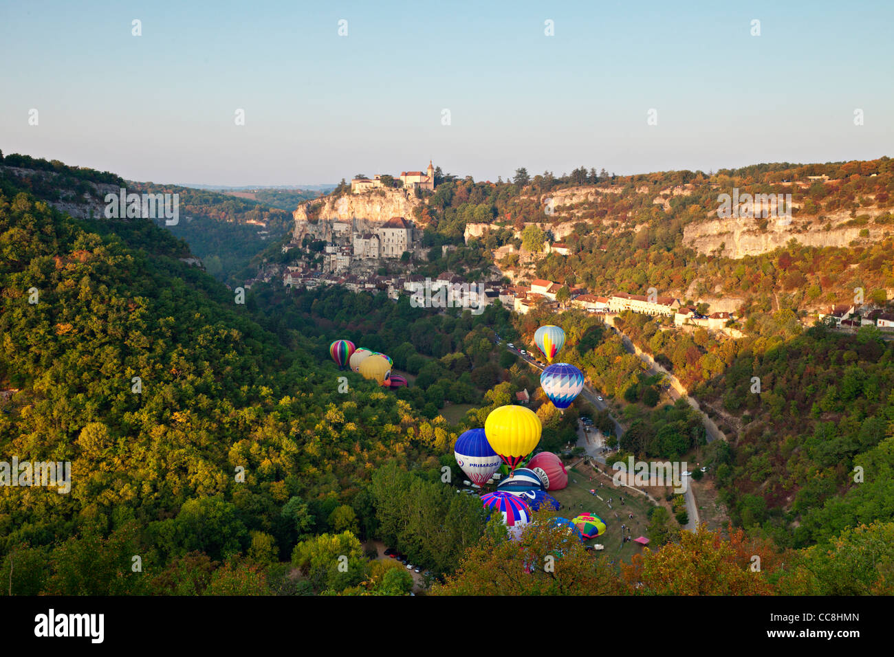 Hot air balloons (montgolfieres) at Rocamadour in the early morning. Stock Photo