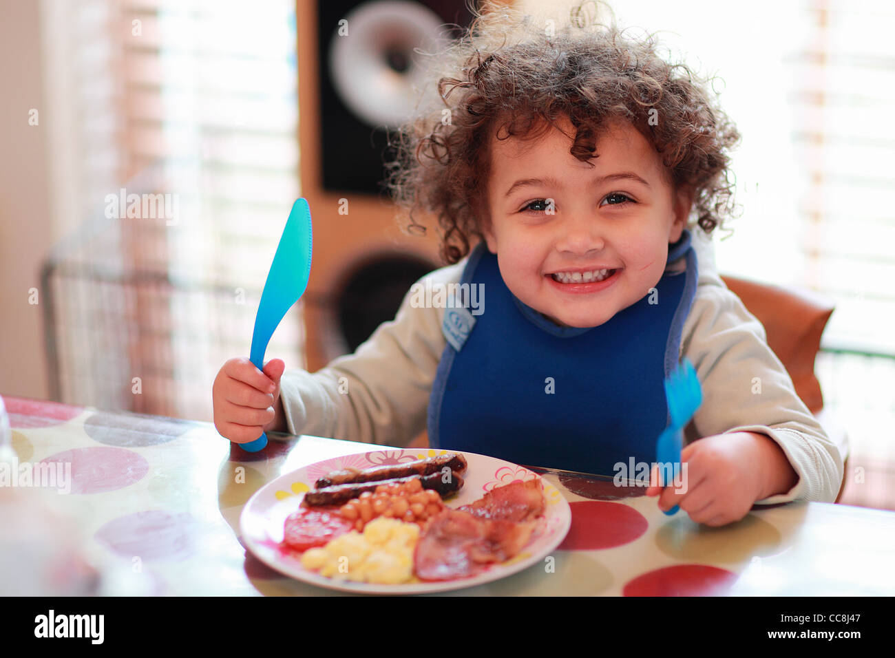 Toddler Eating Fry Up Breakfast Stock Photo
