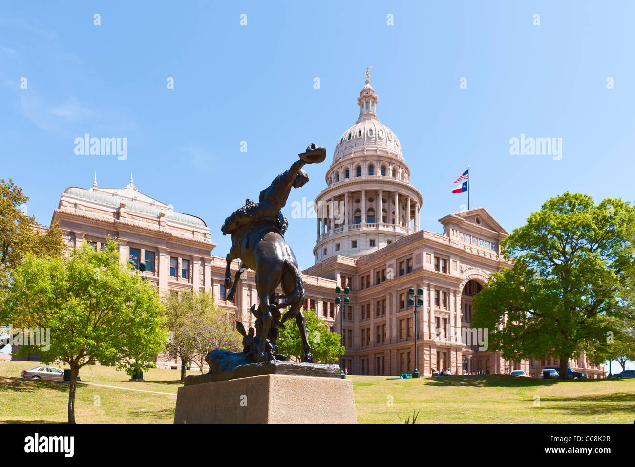 Texas cowboy statue & state Capitol, Austin, TX Stock Photo Alamy