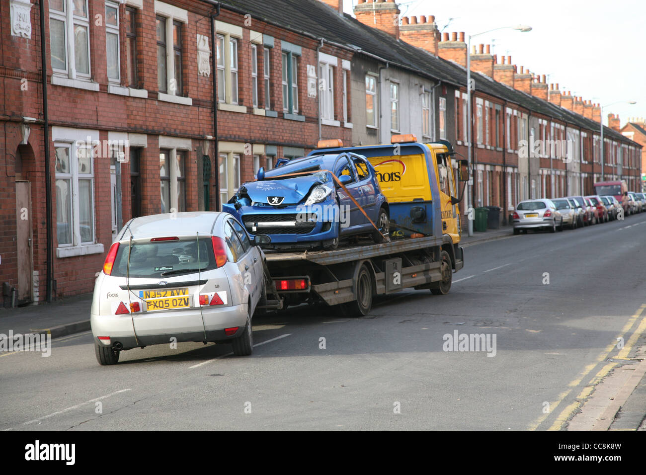 a vehicle being towed away from an accident Stock Photo Alamy