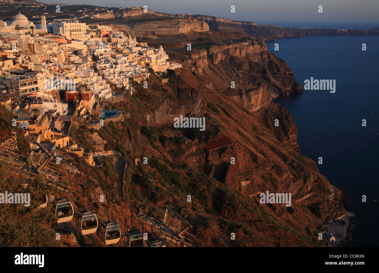 The caldera at Thira, Santorini, Cyclades Islands, Greece at Sunset (dusk). Cable car in foreground Stock Photo