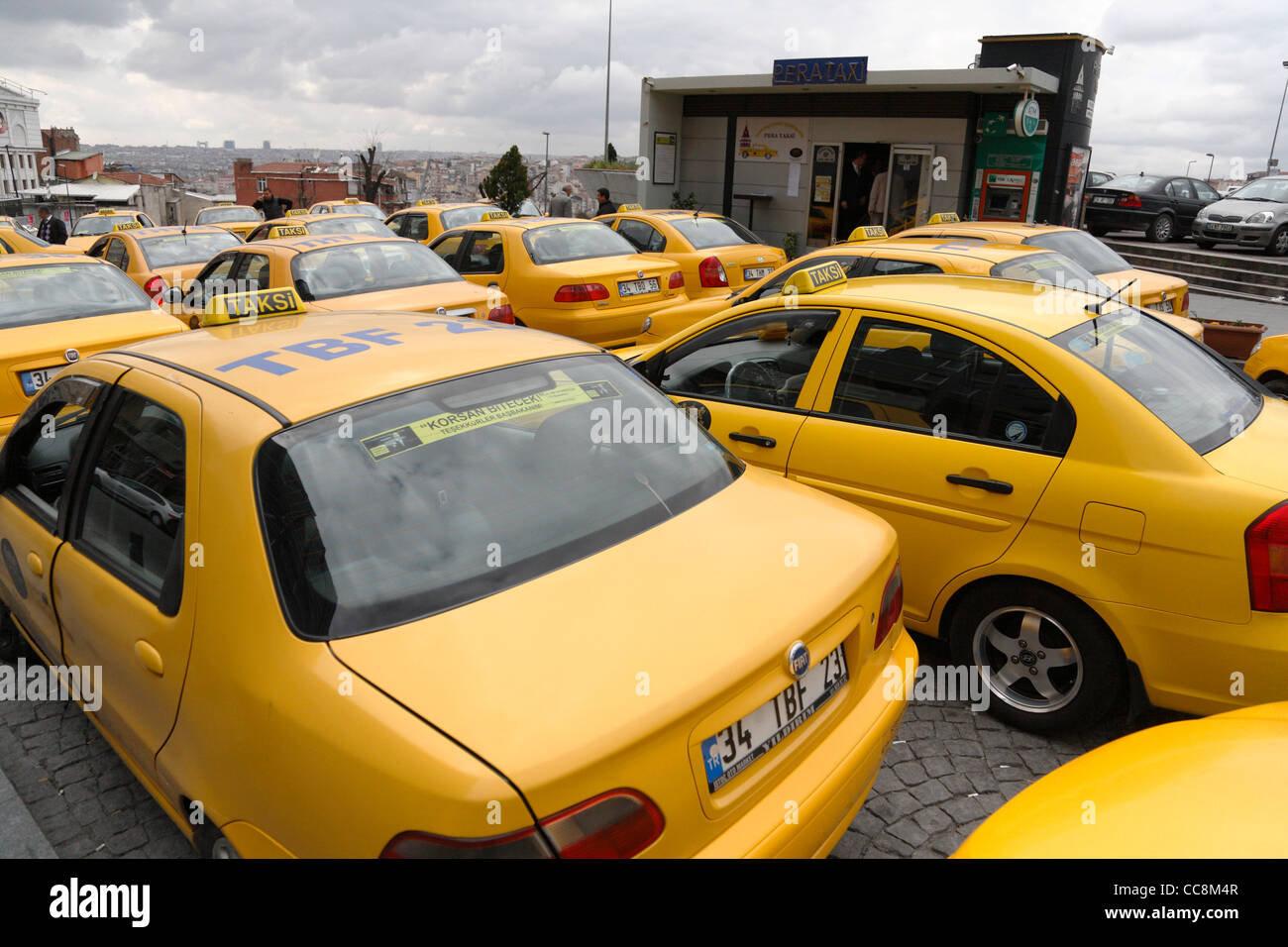 Taxi rank in the Galata shopping district Yellow cabs waiting for trade in turkey taksi Stock Photo