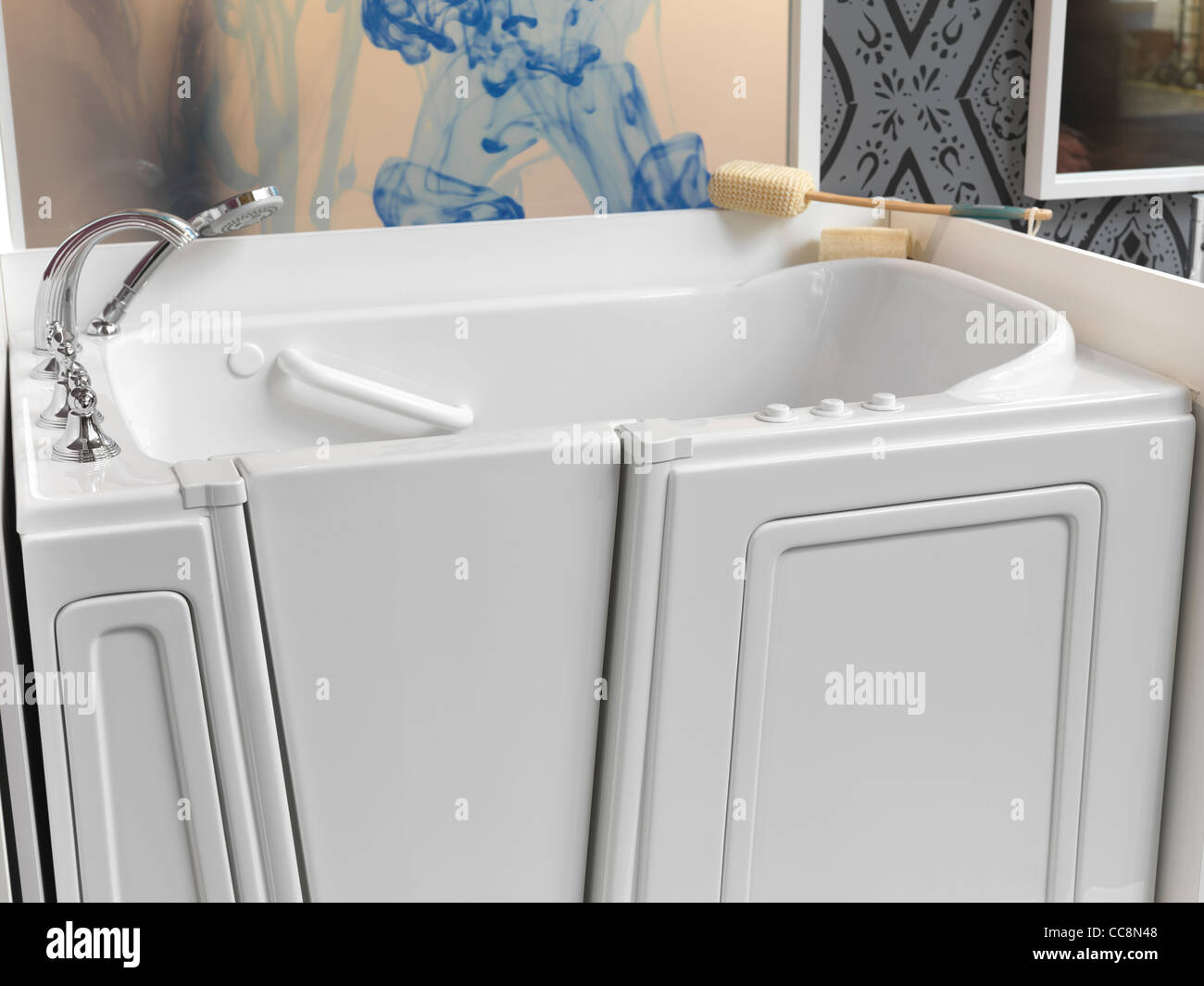 Accessible sitting shower bath tub with a door for people with disabilities Stock Photo