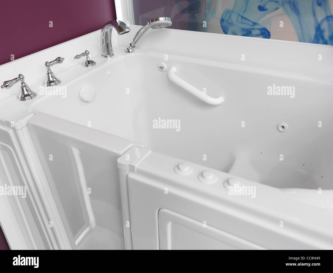 Accessible bathroom. Sitting shower bath tub with a door for people with disabilities. Stock Photo