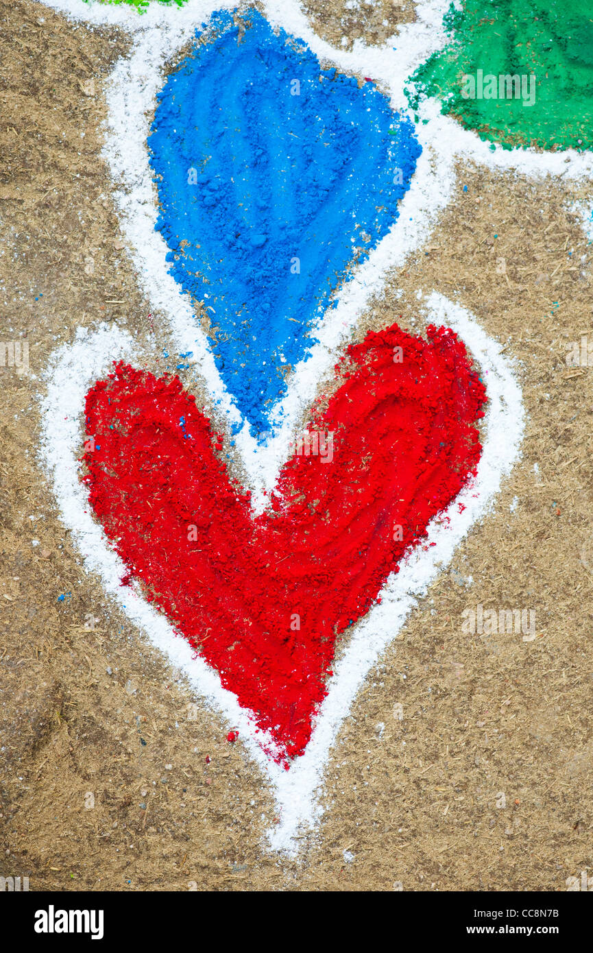 Rangoli festival heart shape coloured powder festival design. Andhra Pradesh, India Stock Photo