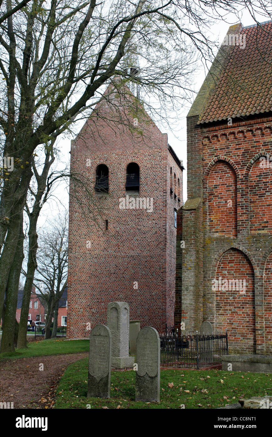 Freestanding tower and church from the 13th century in Garmerwolde Stock Photo