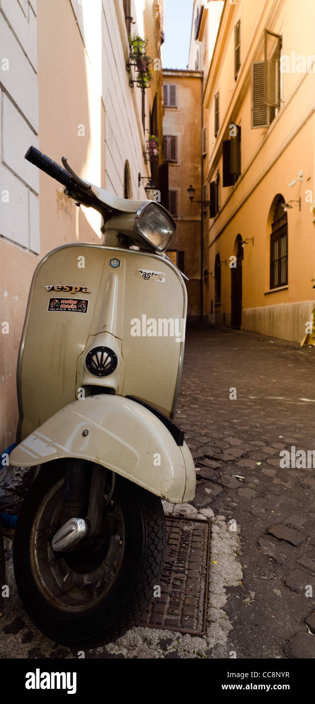 Scooter Vespa Piaggio parked in back street Rome Italy Stock Photo