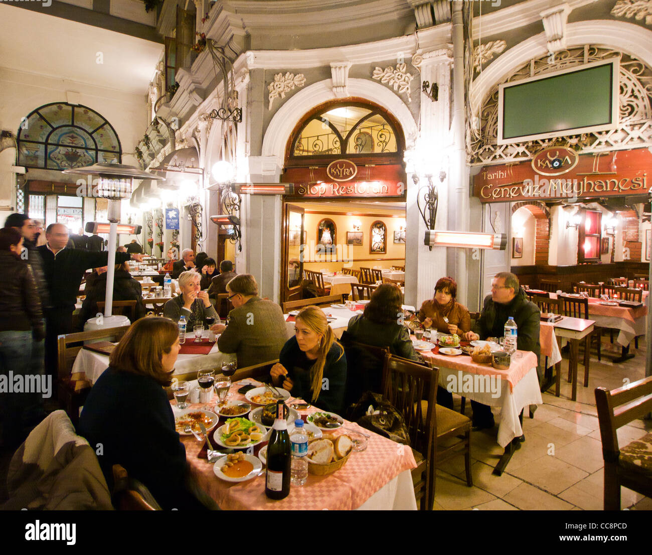 People dining at restaurants in Tarihi Cicek Pasaji Istanbul Turkey Stock Photo