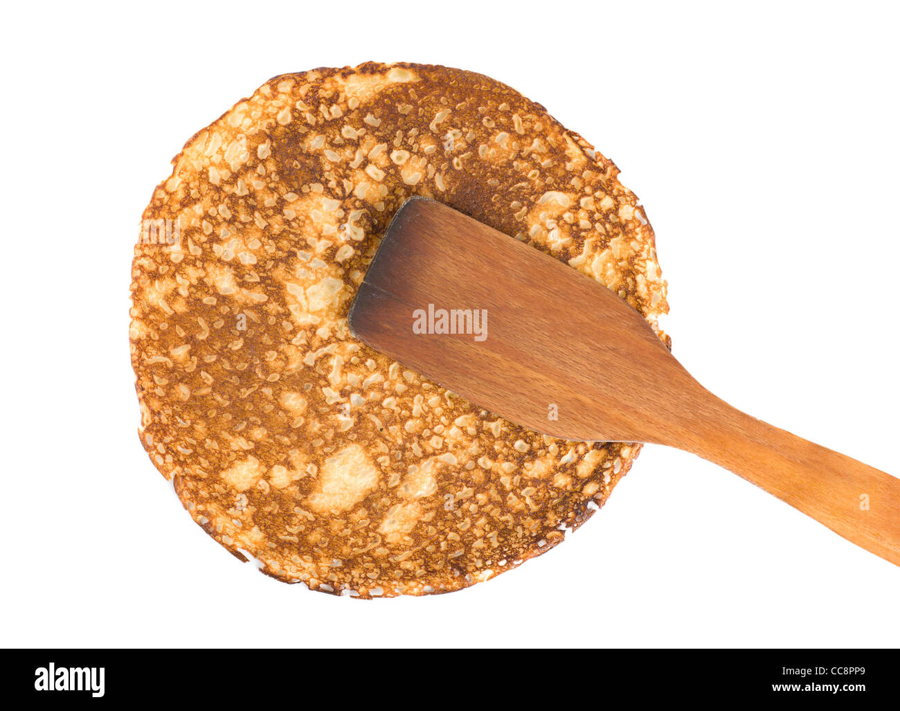 Pancake with a spatula isolated on white background Stock Photo