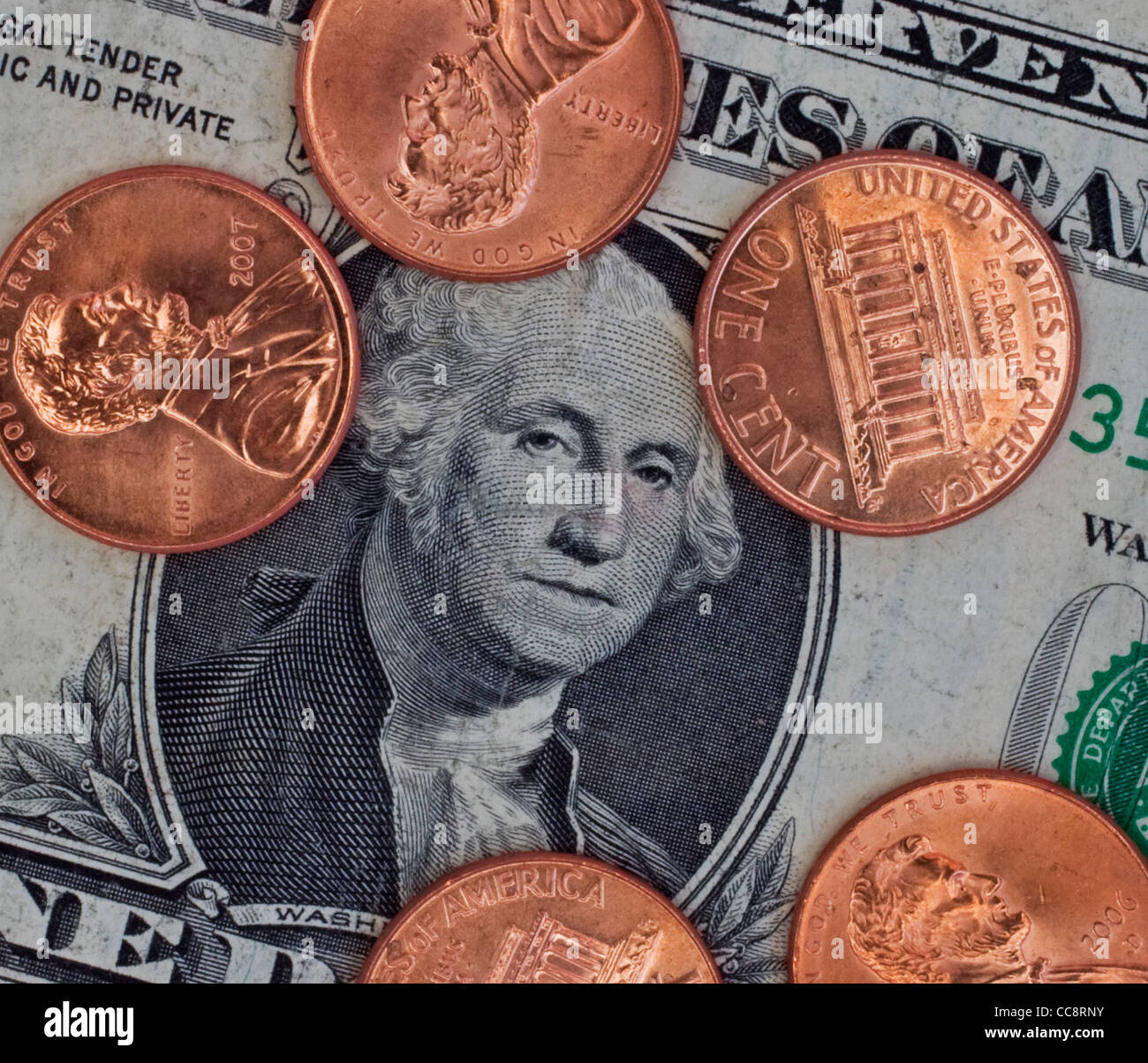 pennies on a dollar Stock Photo - Alamy