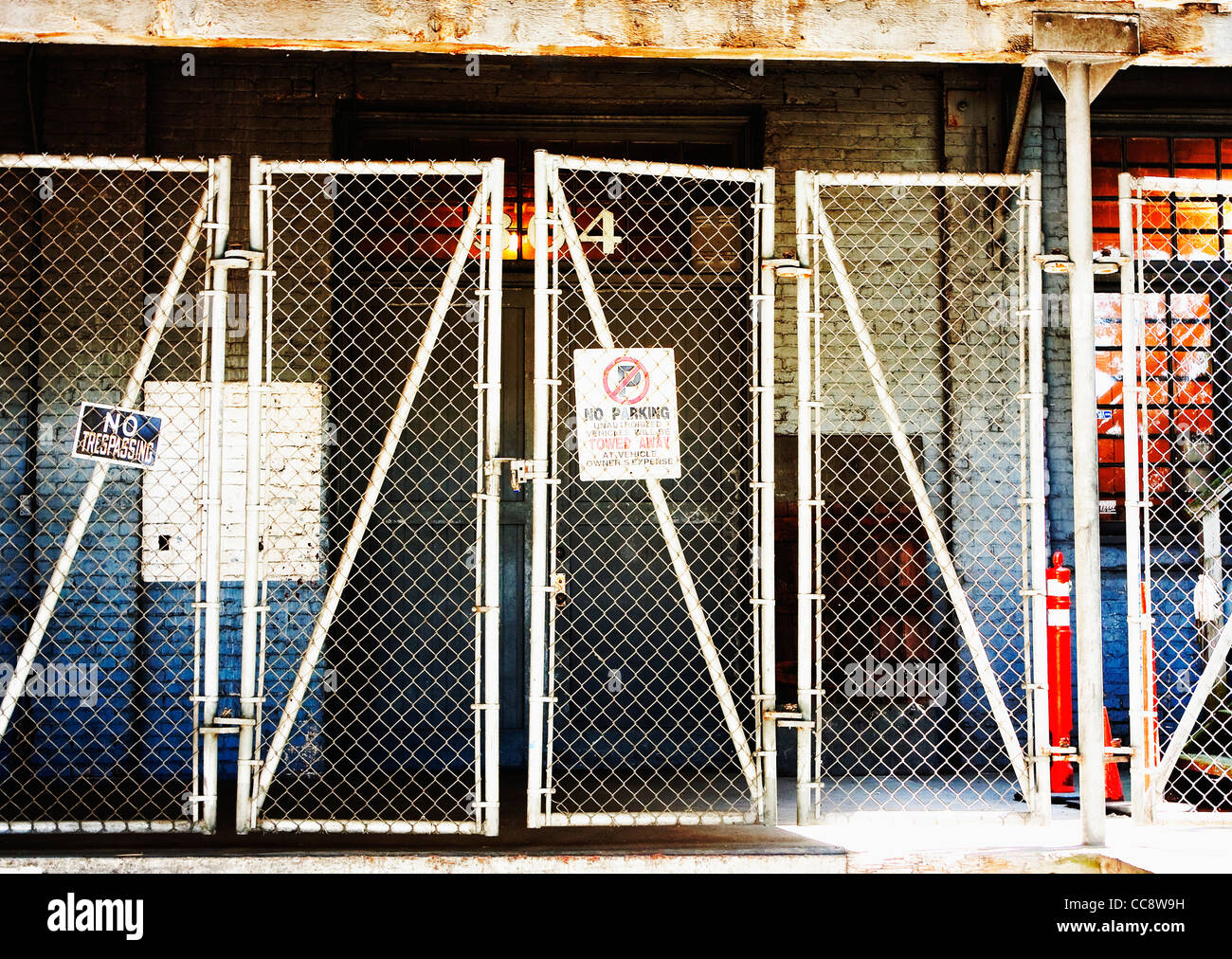 downtown fenced in business loading dock gate Stock Photo - Alamy