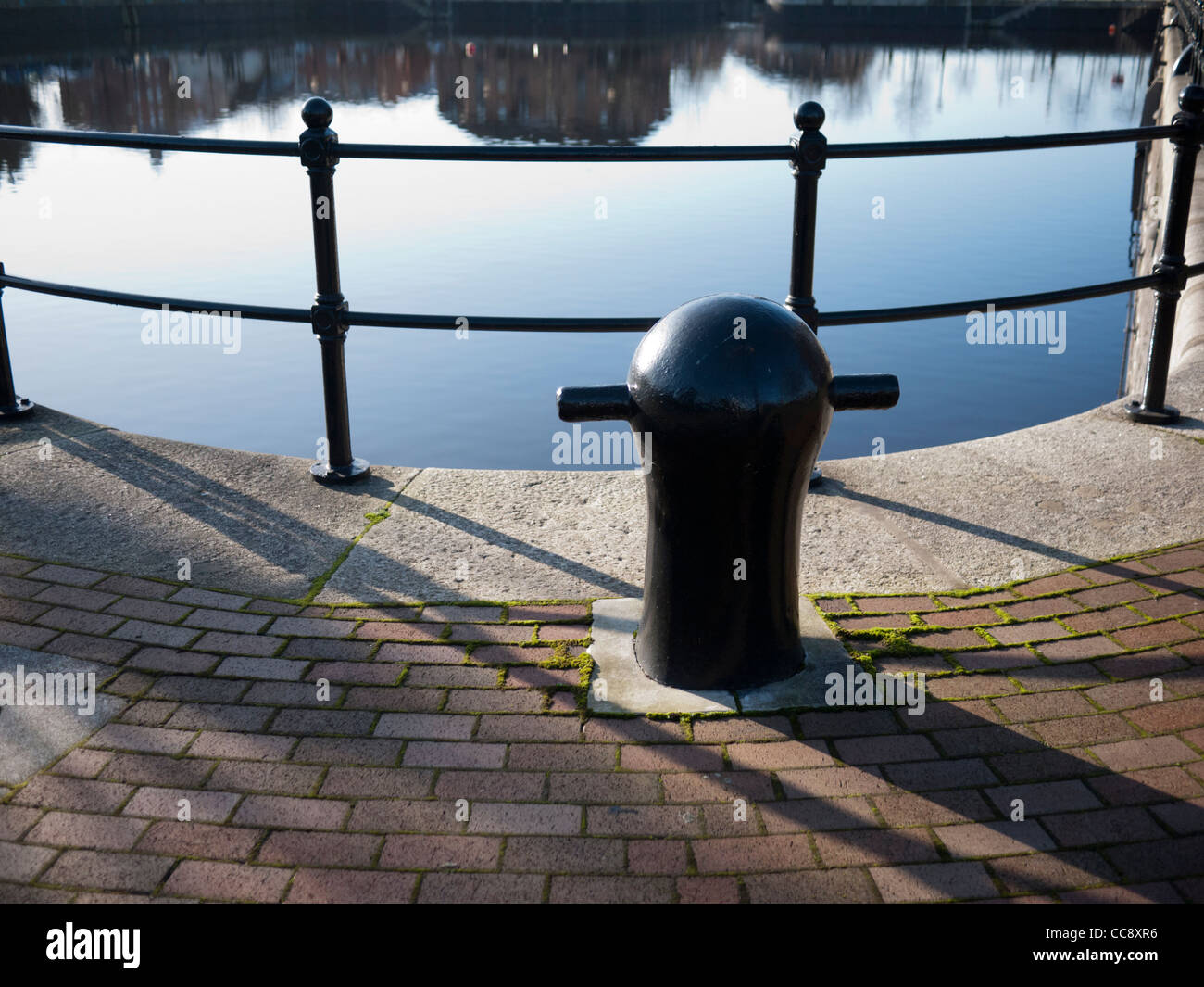 An old mooring post at Salford Quays Manchester England UK Stock Photo