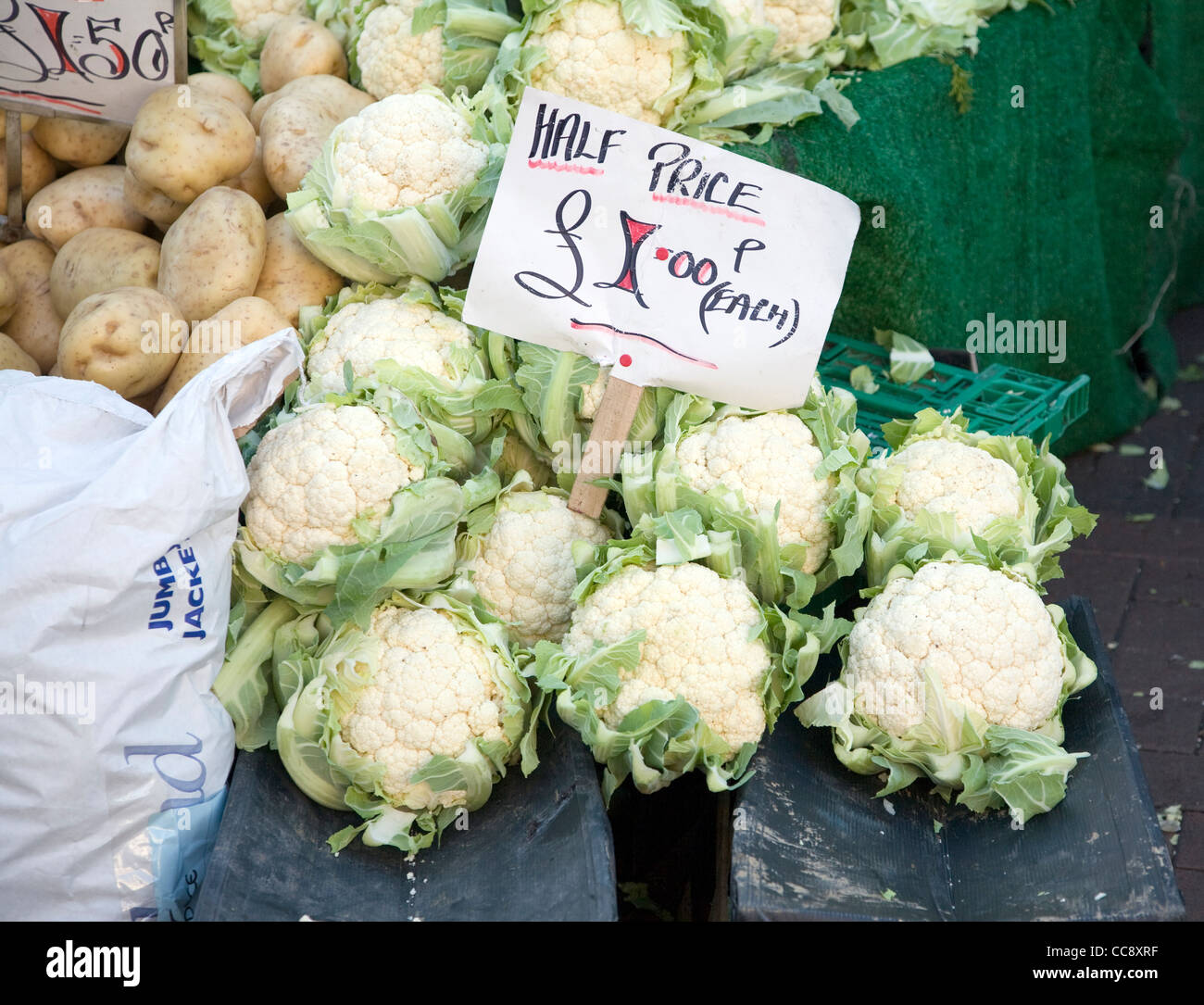 Half price cauliflower for sale market stall £1 each Stock Photo