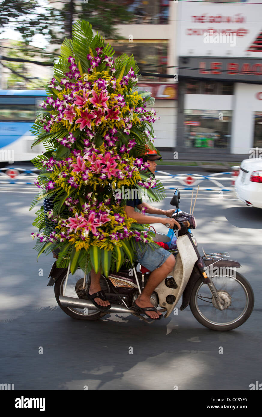 Motorbike overloaded with Plants or Flowers in Ho Chi Minh City Vietnam Stock Photo