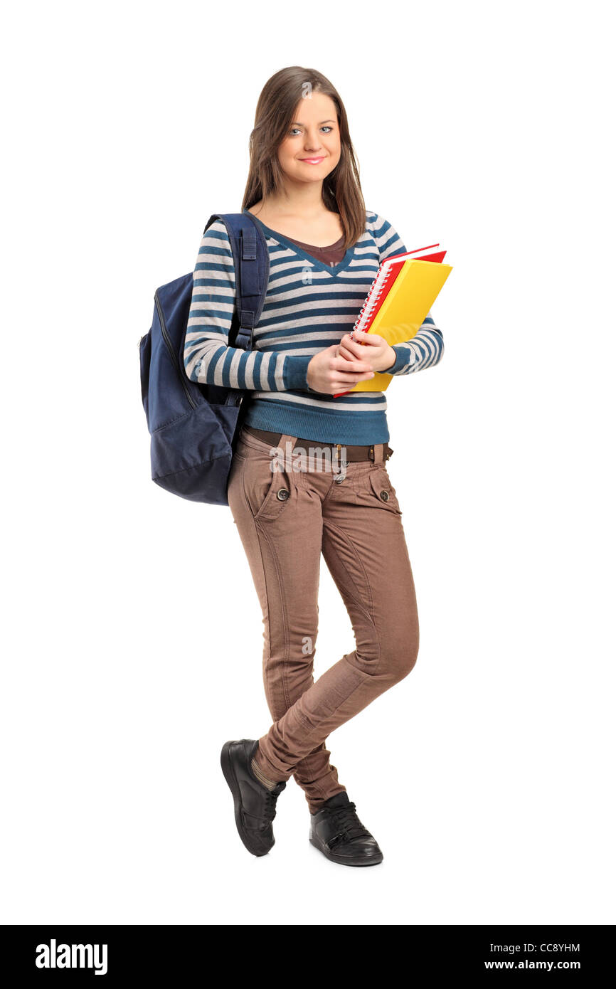 Full length portrait of a smiling school girl posing with her books ...