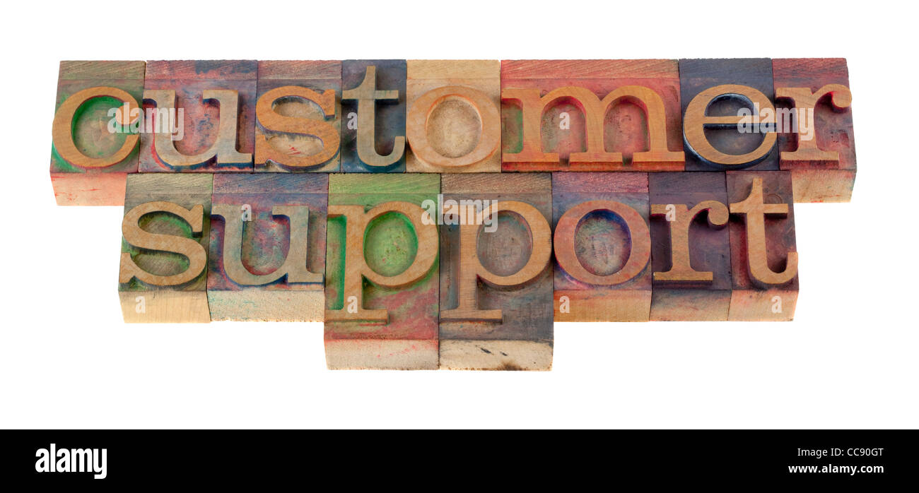 customer support word in vintage wooden letterpress type blocks, stained by color ink, isolated on white Stock Photo