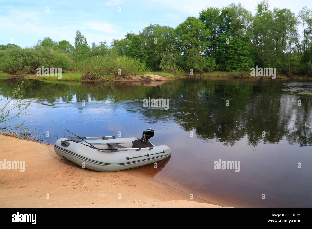 rubber boat on coast river Stock Photo Alamy