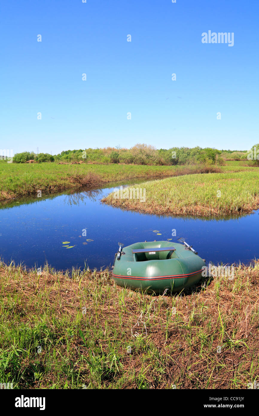 rubber boat on coast river Stock Photo Alamy