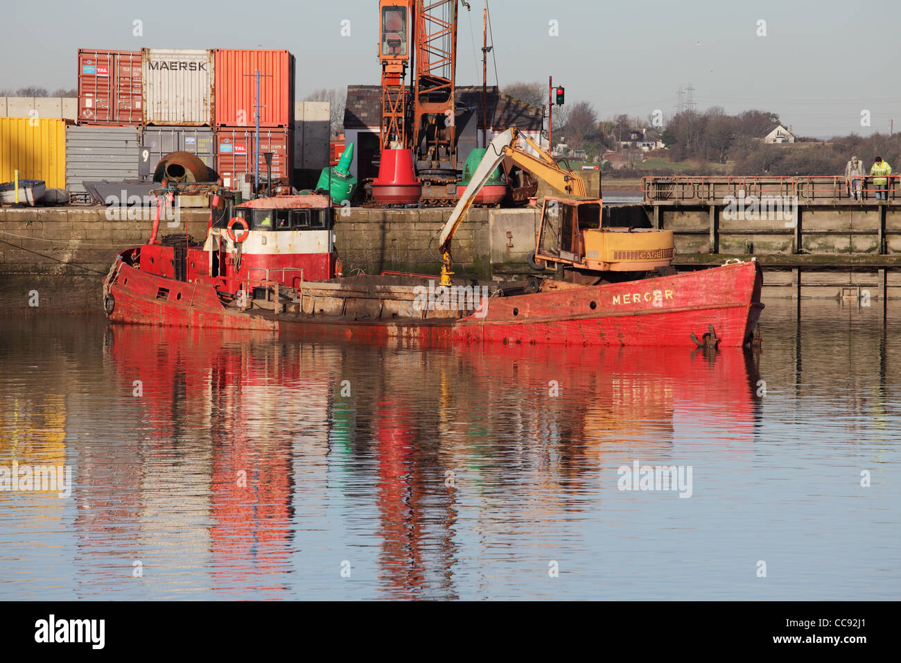 The dredger Merger works within Glasson Dock north west England UK Stock Photo