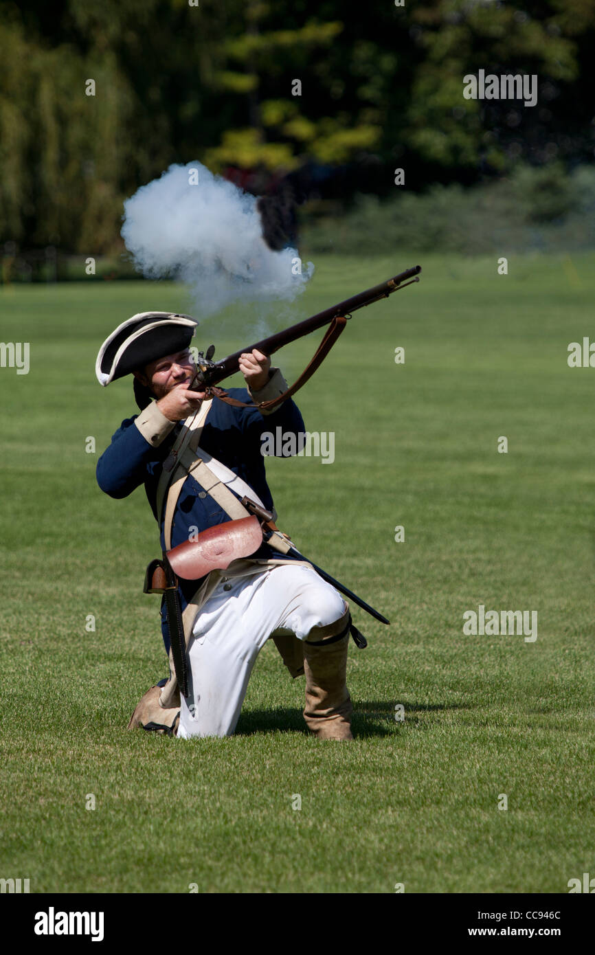Union soldier firing his rifle during a Civil War reenactment. Stock Photo