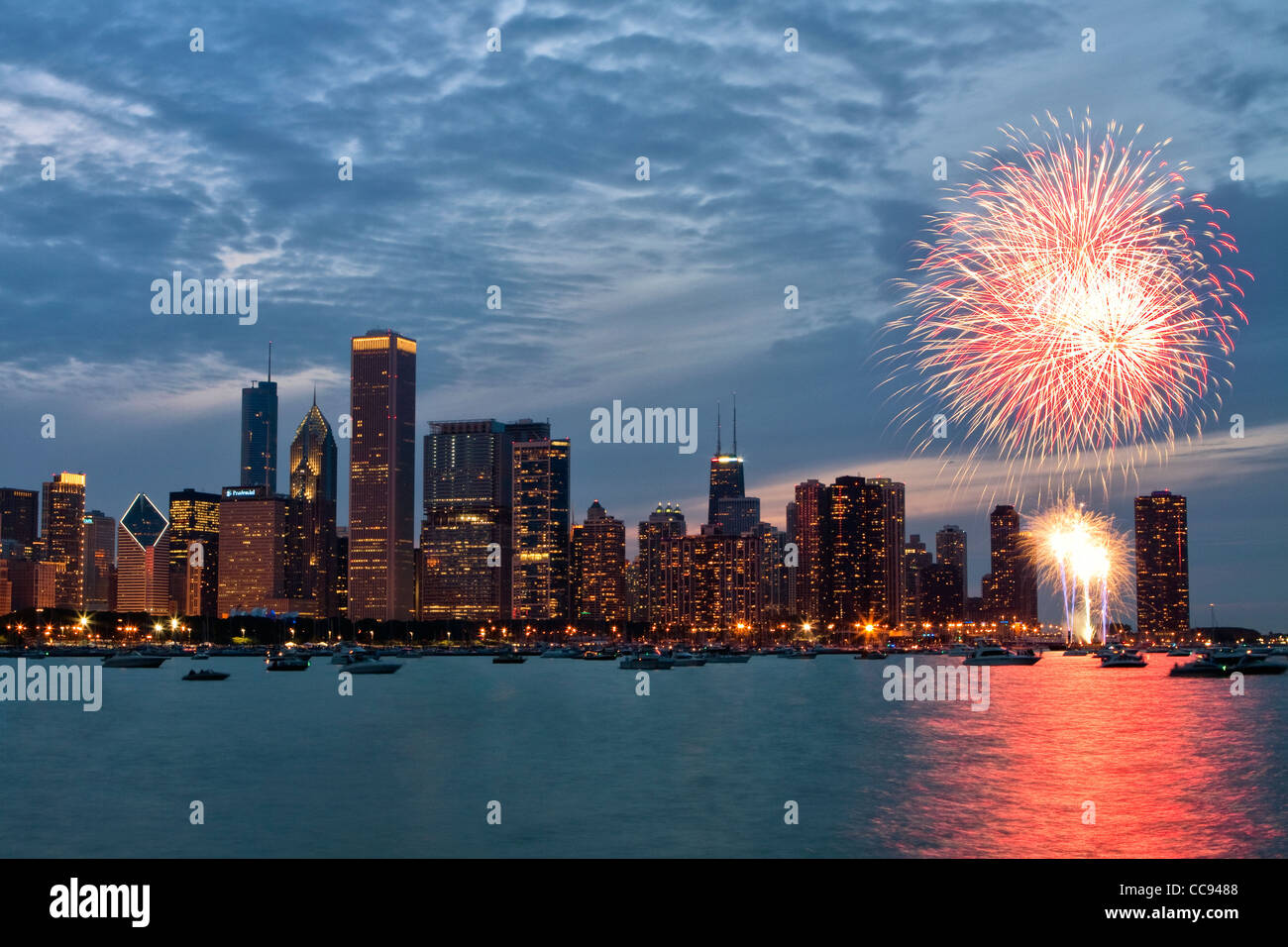 Independence Day fireworks by Chicago skyline over Lake Michigan. Stock Photo