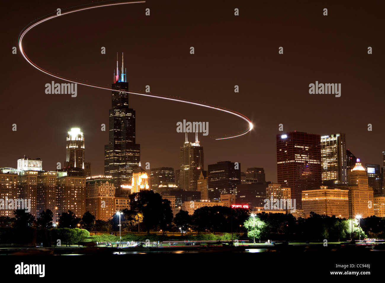 A helicopter trail around Willis Tower (formerly Sears Tower) over Chicago Skyline. Stock Photo