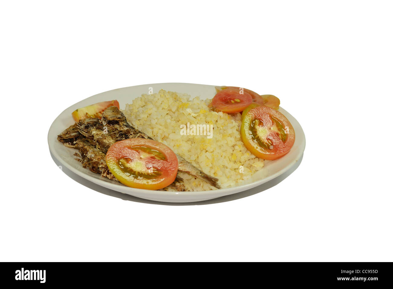 Exotic dried fish with garlic rice and tomatoes. Stock Photo