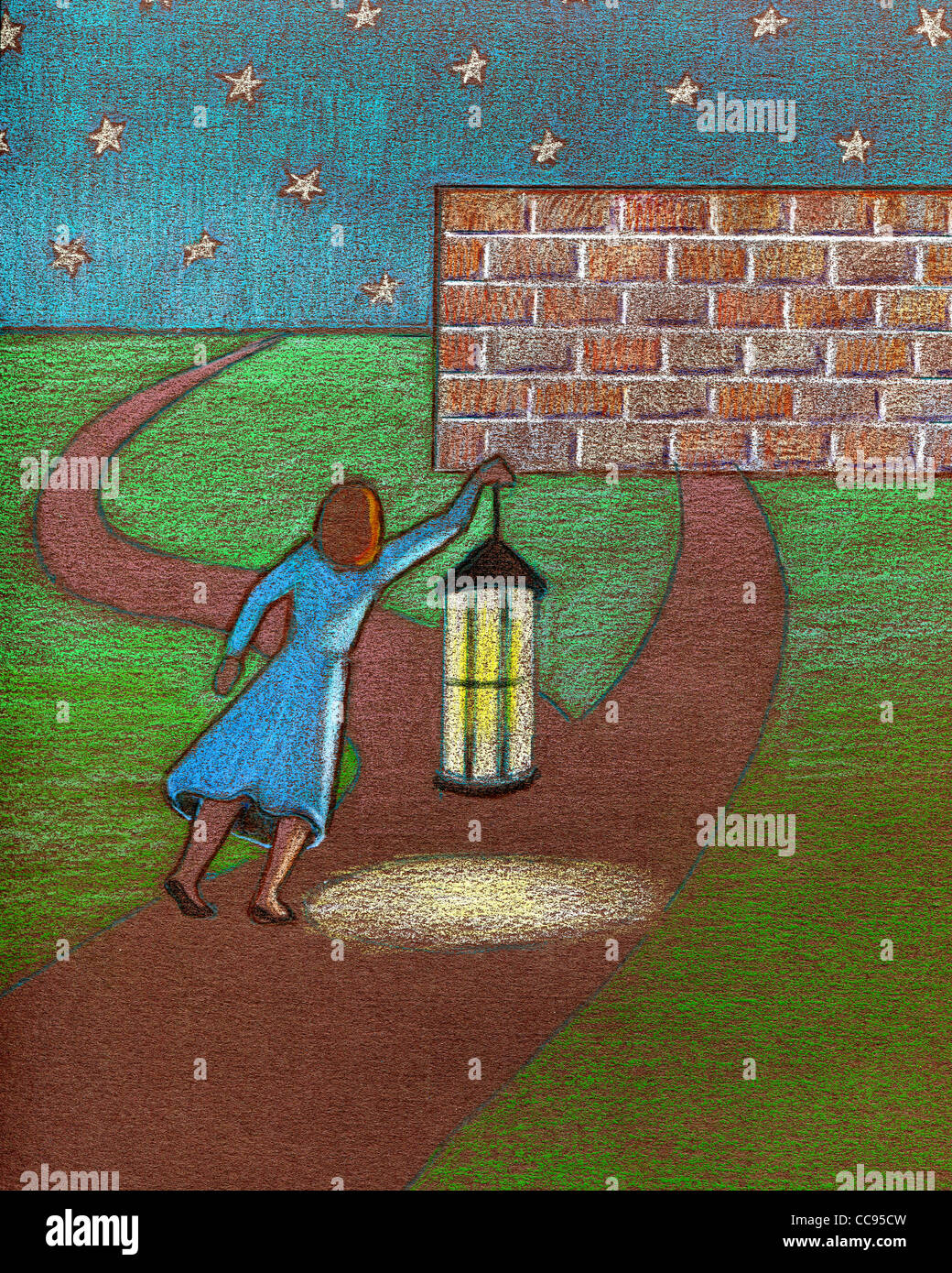 A businesswoman using a lantern to light her way along a path Stock Photo