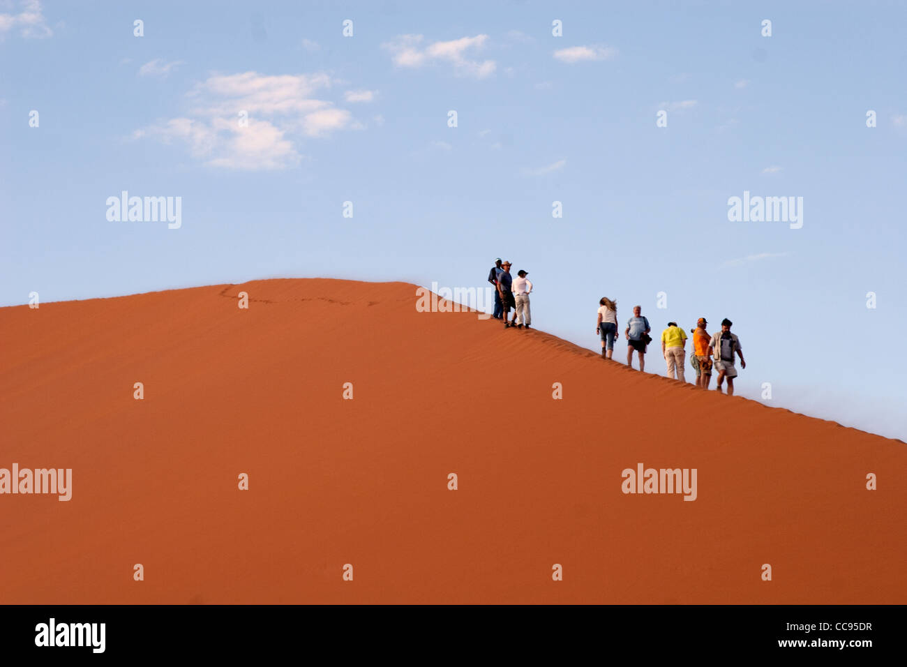 Tourists climbing Dune 45, Namibia Stock Photo