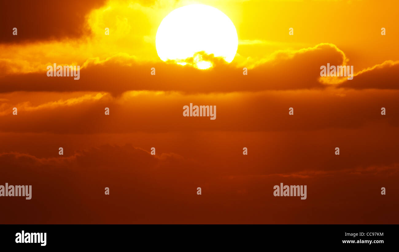 Cloudy golden sunset with sun dog hi-res stock photography and images ...