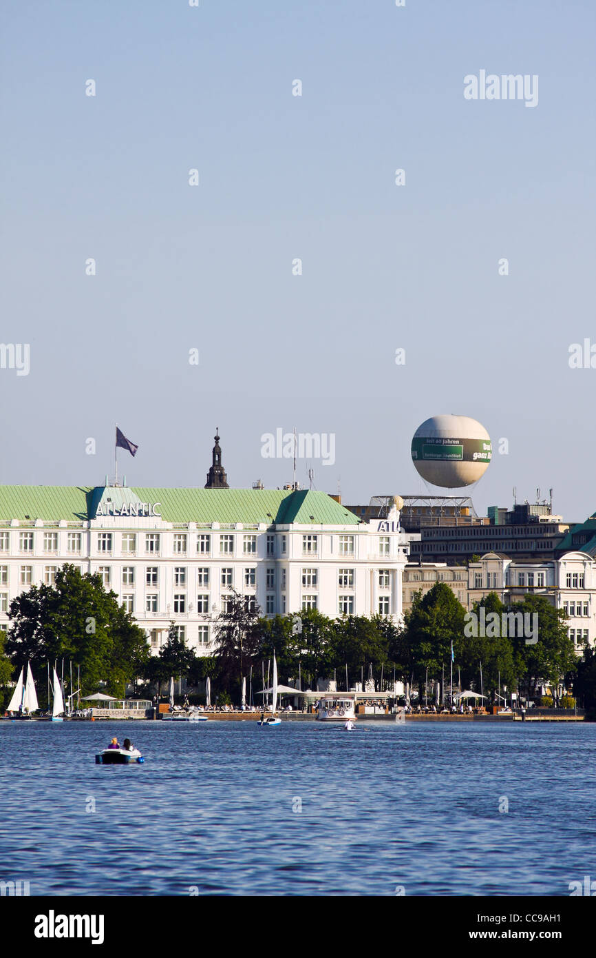 View of people rowing and sailing on the lake Alster in Hamburg, Germany. Stock Photo