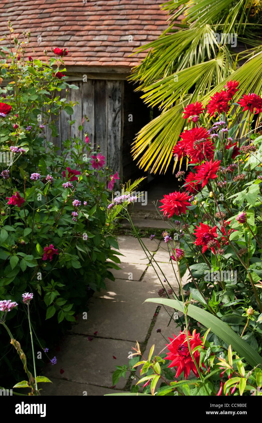 Colourful flowers in an old cottage garden Stock Photo - Alamy