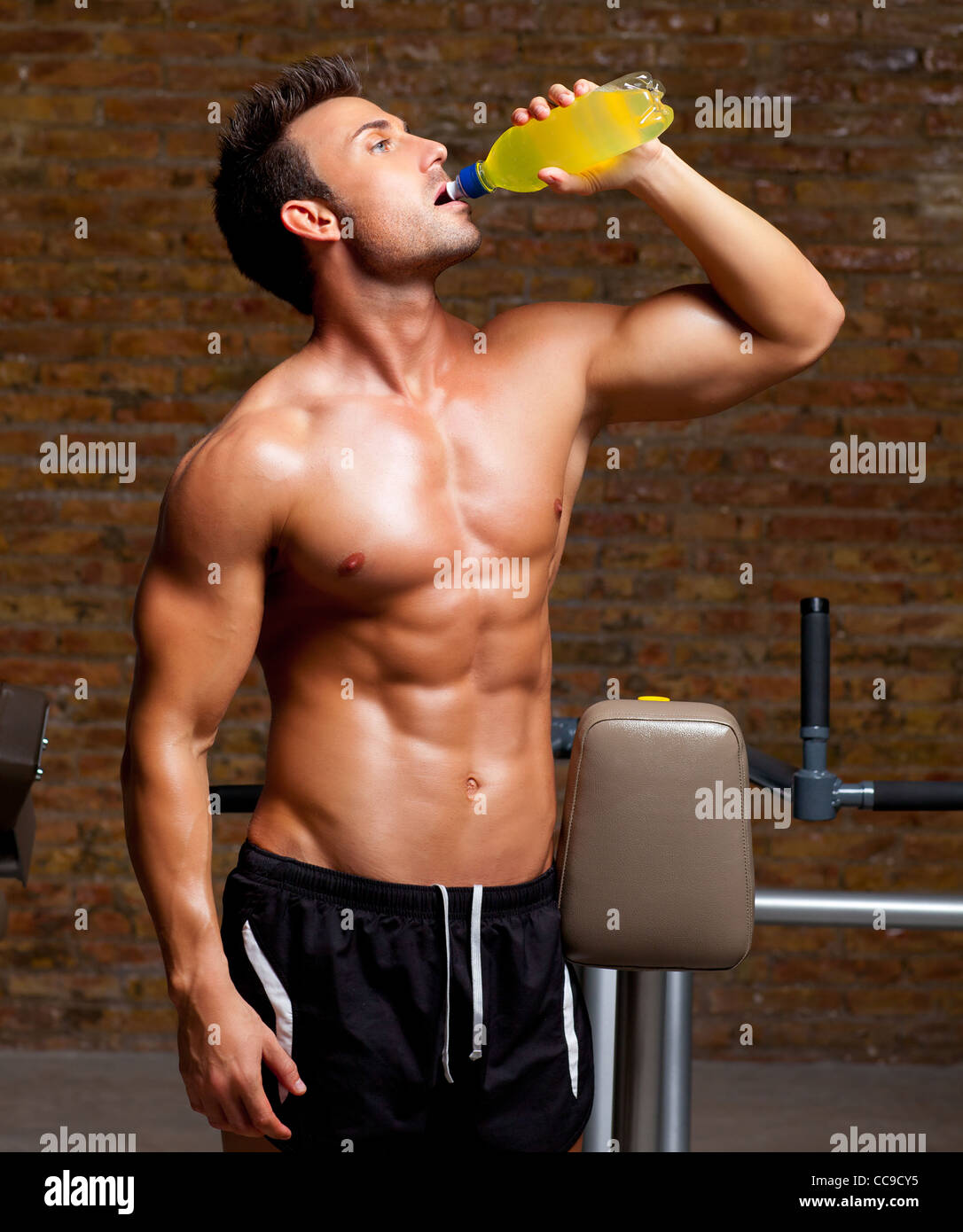 muscle shaped man at gym relaxed drinking energy drink Stock Photo Alamy