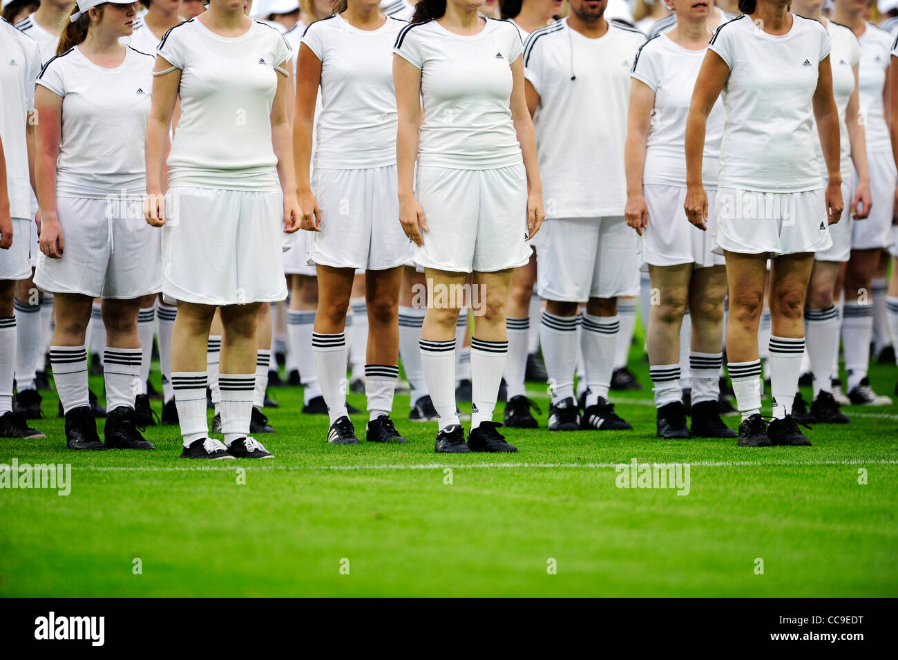 group of teenagers dressed in white during pe-match show of football match  Stock Photo - Alamy