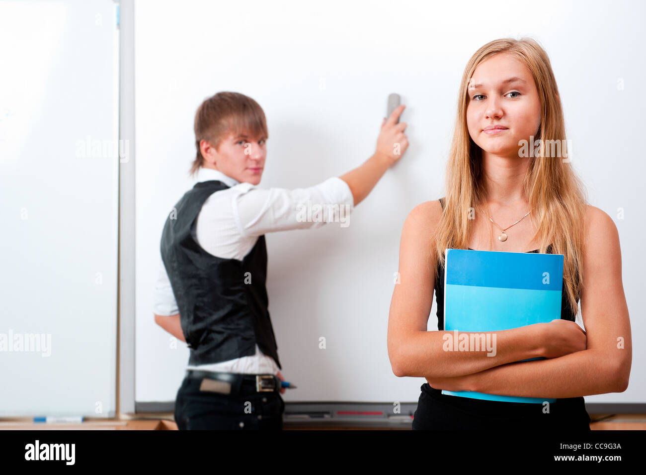Portrait of college students making presentation of their project in