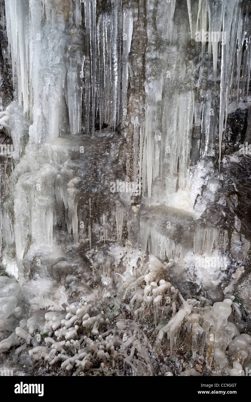 Icicles growing in winter on an overhanging cliff along th eVrbas river valley, Bosnia and herzegovina Stock Photo