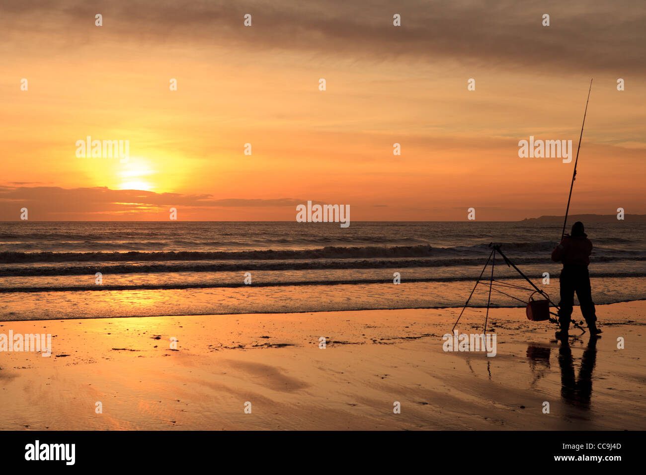 Fisherman at Sunset, Aberavon Beach, Port Talbot, South Wales, UK Stock Photo