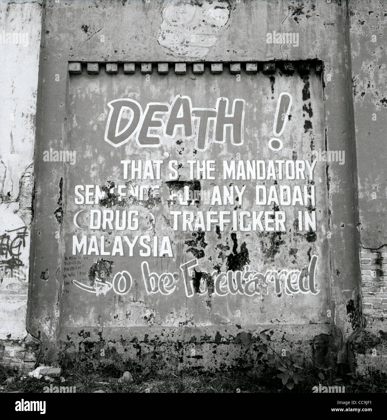 A warning of the death penalty for drug trafficking on the wall of Pudu Prison in Kuala Lumpur in Malaysia in Far East Southeast Asia. Narcotics Art Stock Photo