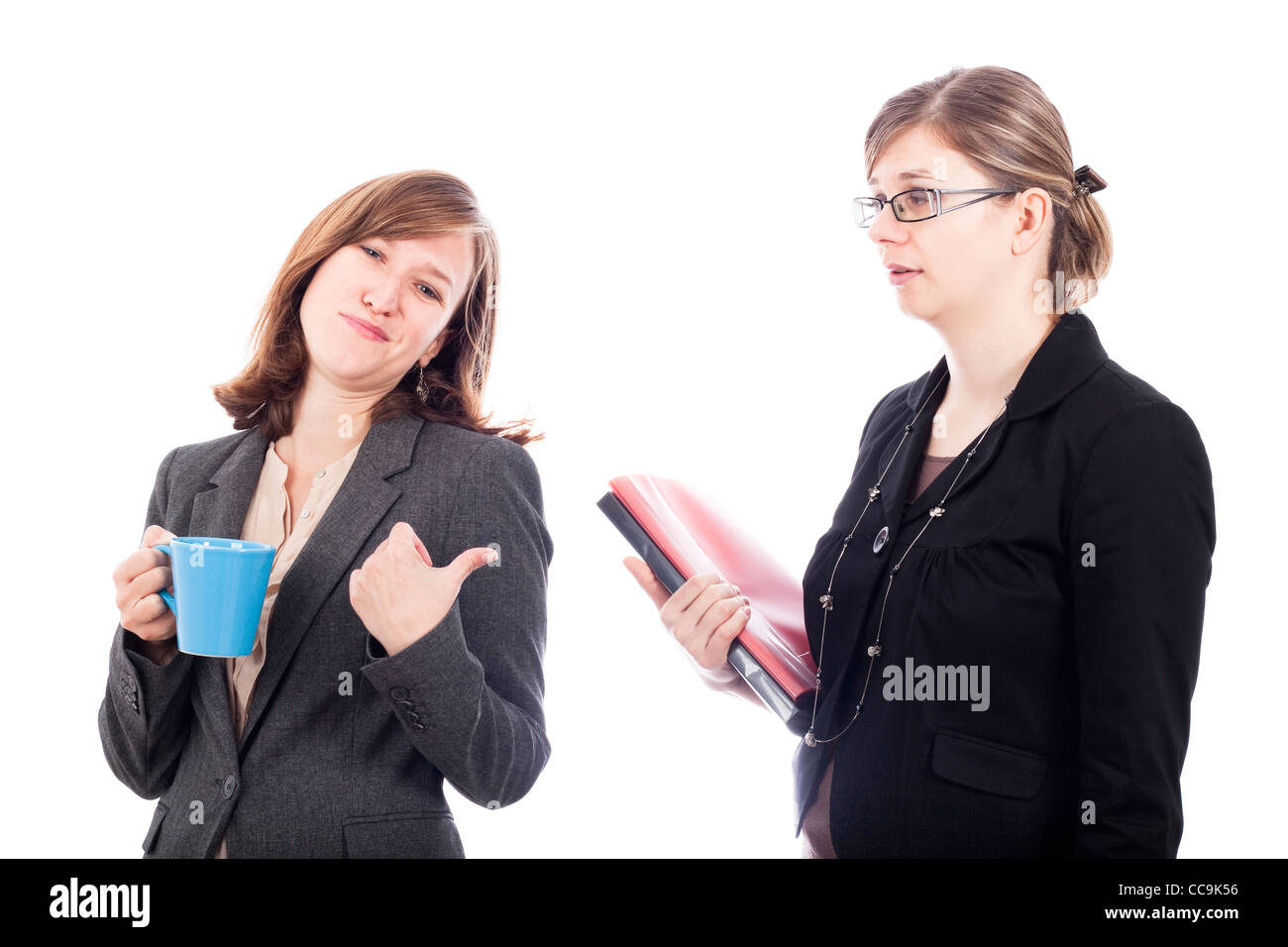Two business women colleagues rivalry concept, isolated on white background. Stock Photo