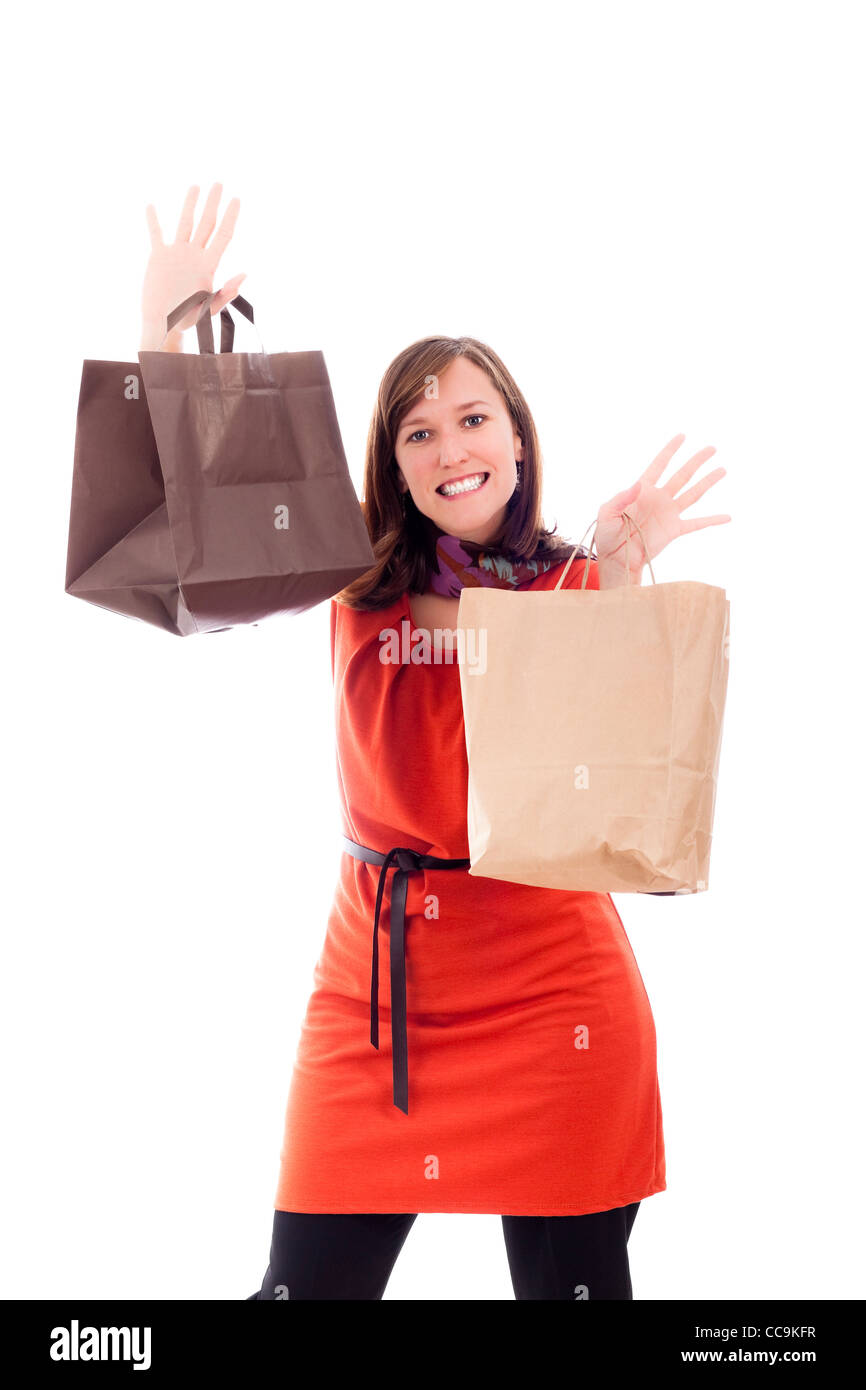 Young happy woman shopping, isolated on white background. Stock Photo
