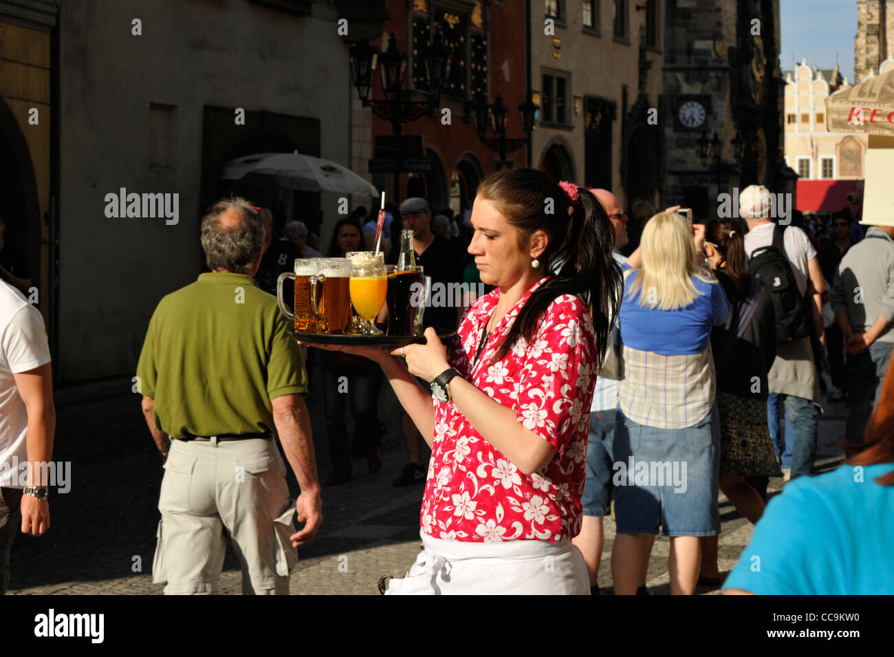 Waitress serving drinks in the Old town square Prague Czech Republic Stock Photo