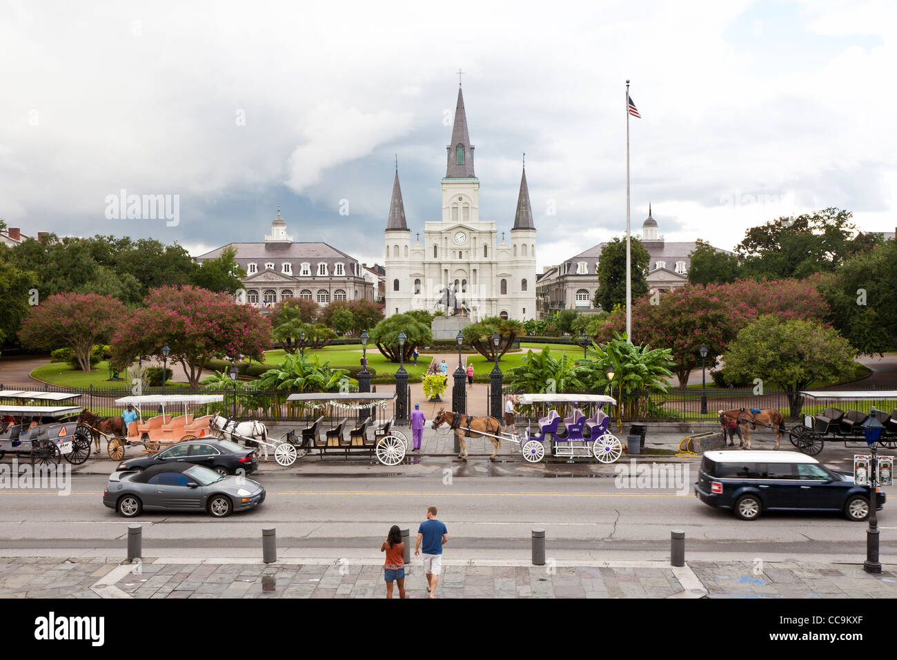Horse and carriage vendors line up on Decatur Street in front of Jackson Square in the French Quarter of New Orleans, LA Stock Photo