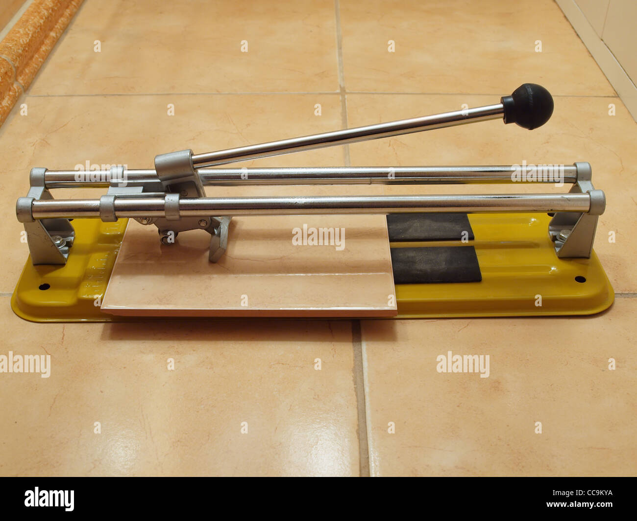 Construction works ceramic tile cutter with tile Stock Photo Alamy