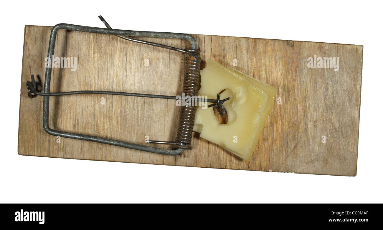 The old mousetrap with cheese on a white background Stock Photo